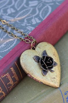 Note: I am unable to put quotes in the heart shaped vintage lockets. Thank you for understanding. This rustic heart locket is restored vintage. I added a dark bronze 3D Rose on the front. The contrast of the colors is stunning. The locket is generous, measuring 47mm! It holds two photos and the inside has a copper perimeter to hold them in tightly. It hangs on a brass chain and closes securely with a lobster clasp. Gorgeous gift or a lovely vintage accessory for you collection. It comes beautifu Vintage Brass Heart Charm Necklace, Vintage Heart-shaped Brass Jewelry, Vintage Brass Heart Shaped Jewelry, Vintage Brass Heart-shaped Jewelry, Vintage Antique Gold Heart Pendant Necklace, Antique Gold Heart Pendant Vintage Necklace, Vintage Brass Heart Jewelry, Vintage Brass Heart Necklace, Vintage Heart-shaped Brass Necklace