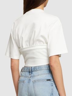 Corset structure at hem with front with lace-up closure. Model is wearing a sizeS Fitted White Top With Cropped Hem, Fitted White Cropped Top, White Fitted Top With Cropped Hem, White Fitted Crop Top With Cropped Hem, White Cotton Cropped Hem Top, White Cropped Cotton Top, White Cotton Cropped Top, Fitted Cropped Top For Spring, Fitted Cropped T-shirt For Spring