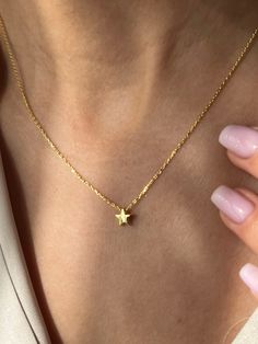 Tiny star from the sky⭐ Get this cute jewelry made with the high quality elements✨ You can go with 925K Sterling Silver with the options of Gold, Rose Gold or White Gold finish Beautiful jewelry for everyone 💙 Details * 925K Sterling Silver → 14K Gold, Rose Gold or White Gold plated * Chain length is approximately 18 inches (16+2 in extender) / 45 cm (40+5 cm extender) * Time is important! You will receive your package as soon as possible 🚚 * We care about the quality of metal to make sure it will last for a long time * We use enamel technique to color the jewelry and high quality zircons only * There can be tiny differences on each item, length difference of the chain as well as color changes and shade differences of the stones and enamel is possible since each jewelry piece is unique a 14k Gold-filled Star Charm Jewelry, Delicate Star-shaped Yellow Gold Necklace, Delicate Yellow Gold Star Necklace, Minimalist Yellow Gold Jewelry With Star Charm, Delicate 14k Gold Star Necklace, Delicate Yellow Gold Star Jewelry, Minimalist Everyday Jewelry With Star Charm, Yellow Gold Everyday Charm Necklace With Star Charm, Everyday Yellow Gold Charm Necklace With Star