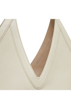 A sculptural shape subtly alludes to the 'M' in Mansur on a pebbled-leather shoulder bag detailed with a soft suede lining and slender tie closure. Tie closure Shoulder straps Suede lining Leather Made in Italy Designer Handbags Elegant Shoulder Bag With Pebbled Texture, Evening Beige Leather Hobo Bag, Elegant Pebbled Texture Shoulder Bag For Formal Occasions, Luxury Shoulder Bag With Pebbled Texture For Daily Use, Office Leather Shoulder Bag With Grained Texture, Chic Formal Shoulder Bag With Pebbled Texture, Chic Formal Bag With Pebbled Texture, Formal Beige Pebbled Leather Shoulder Bag, Leather Top Handle Shoulder Bag With Pebbled Texture