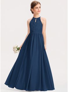 a woman wearing a long blue bridesmaid dress