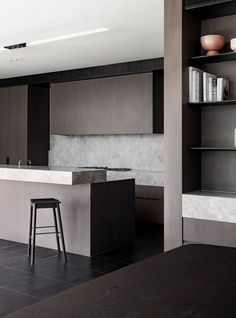 a modern kitchen with black and white tile flooring