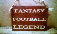 a wooden sign that says fantasy football legend