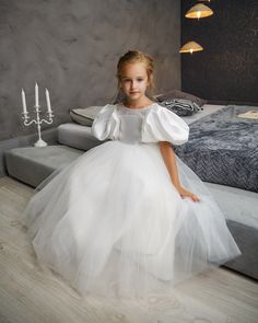 "Incredibly delicate ivory or white flower girl dress. Your girl will be a Princess. Large ruffles sleeves give grace, grandeur. This beautiful flower girl dress is perfect for a wedding, birthday, first communion, family photo shoot or any other occasion. You will shine in this dress! This dresss is made of luxury Mikado fabric You can also add a detachable tulle train with flounces to your dress as well as choose the material you want to have the bow at the back made of (satin/tulle). Please u Ivory Flower Girl Dress, Girls Ball Gown, Princess Flower Girl Dresses, Dress Tutu, Ivory Flower Girl, Princess Flower, Ivory Flower Girl Dresses, Flower Girl Dresses Tutu, First Communion Dress