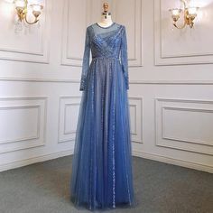 a dress on display in a room with white walls