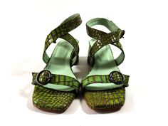 Handmade pistachio green croco leather sandals in chunky low heel. Modern strappy design with square toe and adjustable straps, that embrace and flatters all feet types! Their low block heel and their very soft insole offer true comfort. Genuine leather on the upper and inner parts, soft leather lining and antislip elastic rubber sole. High quality shoes, guaranteed to last for a long long time! PRODUCT INFO Color: green Upper material: 100% leather Linning: 100% leather Heel: leather wrapped He Trendy Green Block Heels With Round Toe, Green Square Toe Heels For Summer, Trendy Green Heels With Heel Strap, Green Sandals With Padded Low Heel, Green Block Heels With Stacked Heel And Round Toe, Trendy Green Heels With Buckle Closure, Trendy Leather Block Heels For Summer, Green Square Toe Heels For Spring, Spring Green Square Toe Heels