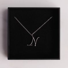 "Silver N Pendant / Silver letter N Necklace / Dainty silver chain necklace / initial necklace / sterling silver chain / personalized jewelry Dainty \"N\" initial. Perfect every day necklace. Lovely gift for your self, sister, bridesmaids, new mom. Convo me if you would like to customize the length of the chain. The possibilities are endless. Pendant: Base metal is brass and silver plated. Chain is 18 inches, sterling silver. (if you would like a longer or shorter chain, please contact us to cus N Necklace, Every Day Necklace, N Initial, Chrysoprase Necklace, Popular Necklaces, Necklace Initial, Jewelry Dainty, Writing Gifts, Initial Necklace Gold