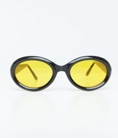 These 1970s black sunglasses are not your average shades - they're sleek, oval-shaped and have a cool yellow tint that's perfect for adding some vintage flair to any outfit. Plus, they offer UV protection to keep those peepers safe from harmful rays while you soak up the sun.Available while supplies last. Unique Sunglasses, Soak Up The Sun, Black Sunglasses, Unique Vintage, Uv Protection, The Sun, 1970s, Sleek, Shades