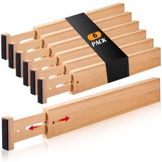 six pieces of wood with black and yellow labels on each side, in front of white background