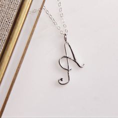 Letter A Initial Necklace - Cursive "A" initial silver pendant - Personalized initial silver pendant for women / Gift for her / for mom Dainty "A" initial. Perfect every day necklace. Lovely gift for your self, sister, bridesmaids, new mom. Pendant: Base metal is brass and Silver Plated on top. Chain is 18 inches, sterling silver. Note: model shots might show a different initial, only to illustrate overall look and length of the chain. This listing is for the "A" initial. Cursive A, A Initial Necklace, Every Day Necklace, A Cursive, A Initial, Birthday Pendant, Word Necklace, Alphabet Necklace, Constellation Necklace