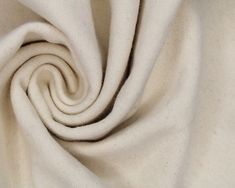 a close up view of a white fabric