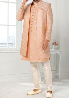 Readymade Art Silk Sherwani, and Jacket. Art Dupion Aligarhi Ready Made Trouser. Resham, Sequences, and Zari Work. Crafted in Chinese Collar Neck, and Full Sleeve. Faux Satin Lining with Plain Work. High-Quality Matching Buttons. Please Note: The footwear shown in the picture is for presentation and photography purpose only. Color: There might be slight color variation due to lightings and flashes while photo shooting. The color may also vary because of different screen resolutions. Wash Care: D Formal Long Sleeve Raw Silk Kurta, Elegant Designer Outerwear For Diwali, Bollywood Style Festive Winter Sets, Bollywood Style Formal Outerwear With Resham Embroidery, Formal Bollywood Outerwear With Resham Embroidery, Festive Traditional Drape Outerwear With Dupatta, Bollywood Style Festive Designer Bandhgala, Elegant Outerwear With Dupatta For Eid, Fitted Long Outerwear For Festive Season