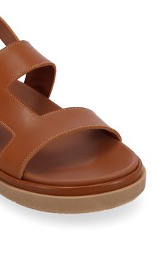 Crisp stitching traces the geometric cutouts of this breezy leather slingback sandal grounded on a cushy, molded footbed for all-day comfort. 1" platform (size 39) Arch support Leather upper and lining/rubber sole Made in Spain Calf Leather Slip-on Sandals With Cushioned Footbed, Leather Flat Sport Sandals For Vacation, Modern Calf Leather Slip-on Sandals, Modern Slip-on Sandals With Stitched Sole, Leather Slingback Sandals With Rubber Sole, Leather Slingback Sandals With Stitched Sole And Round Toe, Calf Leather Sandals With Removable Insole, Slip-on, Calf Leather Slip-on Sandals With Removable Insole, Leather Sandals With Open Heel