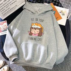 grey color cat hoodies made for men with a picture of a little girl and an orange cat playing with each other and a funny pun written on the hoodie Cute Gray Sweatshirt For Winter, Long Sleeve Cotton Hoodie With Cat Print, Cute Cotton Hoodie With Cartoon Print, Funny Cotton Hoodie For Winter, Cotton Cat Print Hoodie Sweatshirt, Cotton Hoodie Sweatshirt With Cat Print, Cotton Hooded Hoodie With Cat Print, Funny Long Sleeve Cotton Hoodie, Cotton Hooded Sweatshirt With Cat Print