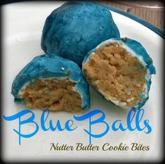 three blue balls on a plate with the words blue balls written below them in blue lettering