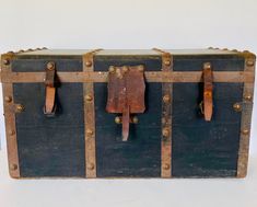 an old trunk is sitting on the floor