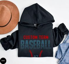 Custom Baseball Hoodie, Baseball Team Name Hoodie, Game Day Hoodie, Baseball Hoodie, Game Day Baseball Hoodie, Customized Baseball Hoodie ABOUT HOODIE GILDAN 18500 MATERIAL - Unisex Heavy Blend Hooded Sweatshirt - Medium-heavy fabric blend of 50% cotton and 50% polyester. - 8.0 oz/yd² ABOUT SIZE - Standard UNISEX size. - Classic fit, pouch pocket, and tear-away label. - Please refer to the size chart to ensure the desired fit. CARE INSTRUCTIONS - Machine wash inside out: cold (max 30C or 90F) - Black Hoodie With Letter Print For Game Day, Black Hoodie For Game Day In Winter, Black Team Spirit Sweatshirt With Drawstring Hood, Black Hoodie With Drawstring Hood For Game Day, Black Team Spirit Hoodie For Winter, Black Team Name Hoodie Sweatshirt, Black Team Spirit Hooded Sweatshirt, Black Winter Hoodie With Team Spirit, Black Team Spirit Hoodie For Sports Events