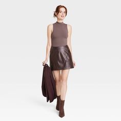 Refresh your separates closet as the seasons change with the Mock Turtleneck Tank Bodysuit from A New Day™. This sleeveless pull-on tank bodysuit is designed in elegant solid hues for a sophisticated look, and it features a mock turtleneck neckline for additional flair. The bodysuit is made from a soft and stretchy cotton-blend fabric to give you a comfortable fit that moves with you, and it boasts a full-coverage bottom with metal snaps at the crotch for added convenience and confident wear. We Casual Turtleneck Bodysuit For Spring, Fall Workwear Bodysuit With High Neck, High Neck Bodysuit For Workwear In Fall, Fall Workwear High Neck Bodysuit, Chic Brown Bodysuit For Fall, Solid Sleeveless Bodysuit For Date Night, Fall Workwear Tank Top, Fall Bodysuit For Workwear, Chic Fall Bodysuit For Workwear