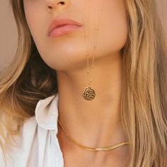 Our Gold Filled Hammered Coin Necklace features a hammered gold coin pendant on a beaded chain. Our 14k gold-filled jewelry is bonded with 14k gold and is water and tarnish resistant. 14k gold-filled jewelry is a great alternative to solid gold, and can be worn by people with sensitive skin. - 14k gold-filled- Circle circumference: 16.2 mm. - Adjustable chain length: 17 in - 19 in.- Waterproof, tarnish resistant & hypoallergenic Hammered Yellow Gold Medallion Necklace Gift, Hammered Yellow Gold Medallion Necklace As A Gift, 14k Gold-filled Yellow Gold Coin Necklace, Everyday 14k Gold Filled Coin Pendant Jewelry, 14k Gold Filled Jewelry With Coin Pendant, 14k Gold Filled Coin Pendant Jewelry, 14k Gold Filled Yellow Gold Coin Necklace, Gold Hammered Round Medallion Necklace, Everyday Hammered Medallion Jewelry