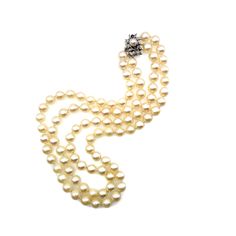 "Pearls are the epitome of style and grace, with their internal glow and lovely luster. This is a gorgeous vintage double-strand pearl necklace from the 1950s crafted with matched 8.5-8.8mm cultured Japanese Akoya pearls. The round pearls have a cream overtone and subtle luster and are secured with a fancy clasp decorated with two natural round-cut sapphires and ten single-cut diamonds in 14K white gold. This timeless necklace is excellent for a vintage-loving bride or a June baby! Pearls have a Classic Evening Necklace With 17 Jewels, Classic Pearl Necklace With 17 Jewels For Wedding, Antique Pearl Necklace For Formal Occasions, Classic Pearl Necklace With Jewels For Anniversary, Classic Oval Necklaces For Evening, Classic High Luster Necklaces For Anniversary, Classic Evening Necklaces, Timeless High Luster Necklace For Formal Occasions, Classic High Luster Pearl Necklace For Formal Events