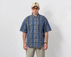 Vintage 90s short sleeve denim shirt in plaid pattern - button down - 2 chest pockets - materials: 75% cotton, 25% polyester, 2% elastane SIZE size from label: XL MEASUREMENTS chest: 50,5 inches (128 cm) length: 31 inches (79 cm) CONDITION: The shirt in great vintage condition. Washed, ready to wear. Casual Relaxed Fit Flannel Shirt, Relaxed Fit Plaid Short Sleeve Button-up Shirt, Plaid Relaxed Fit Short Sleeve Button-up Shirt, Casual Plaid Camp Shirt With Relaxed Fit, Relaxed Fit Plaid Collared Short Sleeve Shirt, Plaid Short Sleeve Camp Shirt With Relaxed Fit, Plaid Short Sleeve Cotton Flannel Shirt, Relaxed Fit Collared Short Sleeve Plaid Shirt, Collared Plaid Short Sleeve Shirt With Relaxed Fit