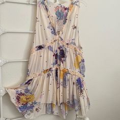 Nwt Free People Summer Dress, In Floral Patterns Of Color Combinations. Lines Of Ruffle Decorations Around, Very Pretty. Womens L Spring Sleeveless Printed Boho Dress, Bohemian Sleeveless Mini Dress For Daywear, Flowy Multicolor Mini Dress For Daywear, Flowy Purple Boho Dress With Floral Print, Flowy Bohemian Purple Mini Dress, Flowy Purple Bohemian Mini Dress, Bohemian Purple Sleeveless Mini Dress, Bohemian V-neck Sundress For Daywear, Summer Boho Print Purple Dress