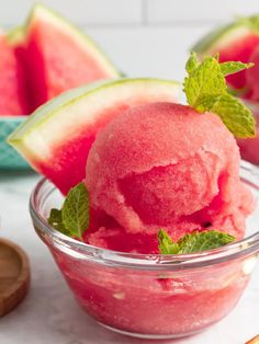 watermelon ice cream in a bowl with mint sprigs on the side