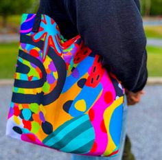 Embrace the rainbow with this stunning tote, a canvas of color for your daily journey! * 100% spun polyester fabric * Bag size: 15″ × 15″ (38.1 × 38.1 cm) * Capacity: 2.6 US gal (10 l) * Maximum weight limit: 44lbs (20 kg) * Dual handles made from 100% natural cotton bull denim * Handle length 11.8″ (30 cm), width 1″ (2.5 cm) * The handles can slightly differ depending on the fulfillment location * Blank product components sourced from China Casual Multicolor Canvas Shopping Bag, Casual Multicolor Canvas Tote Bag, Summer Multicolor Canvas Bag With Large Capacity, Multicolor Canvas Travel Bag For Summer, Trendy Multicolor Canvas Bag For Everyday, Trendy Multicolor Canvas Tote Bag, Trendy Multicolor Canvas Bags, Summer Multicolor Canvas Bag For Travel, Trendy Rainbow Bags For Everyday Use