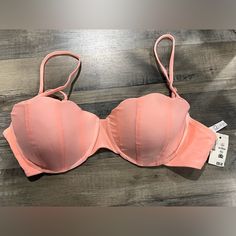 Live Love Dream X Aeropostale This Mermaid Style Bikini Top Exudes An Oceanic Vibe. The Brazilian Swimsuit Top Features An Underwire, Supportive Padded Cups In Seashell Shapes With Tonal Seamed Details, Adjustable Shoulder Strings, A G-Hook Closure At Back For A Flattering And Secure Fit. -Color: Salmon Pink/Light Coral -Size: Xl -Seashell Shaped Bra Cups -Back G-Hook Closure - Adjustable Cami Straps - Underwire Support - Unmovable Paddad Cups - 80% Nylon, 20% Spandex - Wash Dark Colored Clothes Padded Push-up Swimwear, Summer Stretch Push-up Swimwear, Beach Push-up Bra With Removable Pads, Padded Fitted Strapless Swimwear, Strapless Padded Fitted Swimwear, Fitted Padded Strapless Swimwear, Push-up Bra With Removable Pads For Beach, Summer Push-up Swimwear With Adjustable Straps, Fitted Padded Swimwear For Beach Season