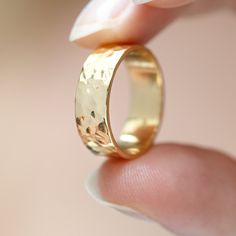 A chunky 6mm hammered gold vermeil ring, designed to make a statement. It's a fabulous gift to your best friend, family member or a minimalist addition to your own collection. Inspired by the tranquil sands and shallows of Agonda, Goa, the Agonda Chunky ring captures the various natural terrains of the area with its textured design. Our expert artisans have used the traditional metalworking technique of hammering to give the ring its texture. The Agonda Chunky ring is from the Agonda family. Its Gold Hammered Thick Band Jewelry, Hammered Round Rings For Gifts, Hammered Rings As Gift, Hammered Round Band Rings As Gift, Hammered Round Band Ring For Gift, Hand Forged Wide Band Ring For Gift, Hand Forged Wide Band Ring As Gift, Hand Forged Thick Band Wide Ring, Hammered Gold Jewelry For Promise