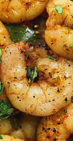 cooked shrimp with herbs and seasoning in a skillet