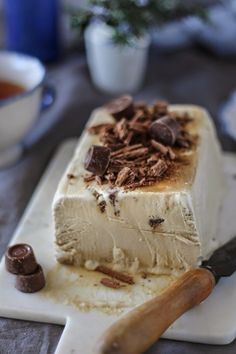 a piece of cake sitting on top of a cutting board