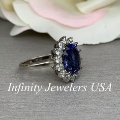 "The ring pictured is lab created blue sapphire with moissanite halo #6248 Rose Gold is available upon request as a custom order and is a final sale (non refunable, non returnable, non exchangeable) Moissanite may take up to 5 to 10 business days to complete and ship, sometimes sooner. -Approximate total carat weight: approx. 5.05ctw diamond equivalent -Center Stone Size: 11x9mm - approx. 4.20ct diamond equivalent -Center Stone Shape: oval -Gem Type: lab created sapphire -Stone Clarity: VS2 -Sto Blue Cluster Ring With Prong Setting For Anniversary, Anniversary Sapphire Cluster Ring With Gemstone, Elegant Diamond Ring For Birthday, Sapphire Gemstone Cluster Ring For Anniversary, Elegant Jewelry With Center Stone For Birthday, Cluster Sapphire Ring With Accent Stones For Anniversary, Sapphire Cluster Ring With Accent Stones For Anniversary, Sapphire Cluster Jewelry For Anniversary, Blue Gemstone Cluster Ring For Anniversary