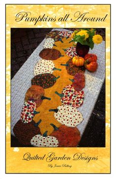 a table runner with pumpkins on it