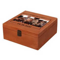 a wooden box with four photos on the front and bottom, inlayed to it