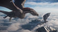 two dragon like creatures flying over the clouds