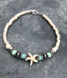 This beautiful boho style beach ankle bracelet is made with a white howlite starfish bead, shades of mint glass beads, gray hematite beads, silver tibetian beads, and cream glass beads. Ankle bracelet comes in several sizes, just choose your size from the drop down menu at checkout. Bohemian Turquoise Starfish Beaded Bracelets, Turquoise Anklets With Starfish Charm For Beach, Turquoise Beach Anklets With Starfish Charm, Bohemian Beaded Bracelet With Starfish Charm, Bohemian Strand Beaded Bracelet With Starfish Charm, Bohemian Beaded Strand Bracelet With Starfish Charm, Bohemian Beaded Bracelet With Starfish Charm For Vacation, Summer Turquoise Beaded Bracelets With Starfish Shape, Bohemian Beaded Bracelet With Starfish For Beach Season