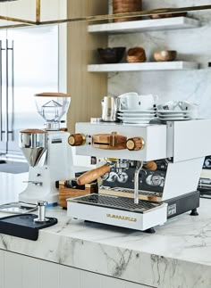 an espresso machine sitting on top of a counter