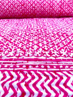 pink and white chevroned fabric with an interesting pattern on it's surface