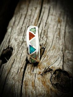 Want this inlaid with different gemstones? Please message me about doing a custom Order 925 Sterling Silver Opal Ring Sterling silver Navajo designed and revived ring inlaid with the Red, Green, White, Blue and Pink opals. Width of ring face: 1/4 of an inch tall. Weight: A Size 11 is 6.8 grams, weight varies for ring size. Silver Opal Ring With Inlay For Anniversary, Anniversary Silver Opal Ring With Inlay, Unique Sterling Silver Opal Ring With Inlay, Unique Sterling Silver Opal Inlay Ring, Bohemian Multi-stone Opal Anniversary Ring, Native American Wedding, Sterling Silver Opal Ring, Native American Bracelets, Eagle Ring