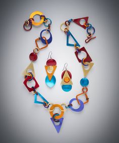 Discover The Purrrfect Toy Earrings & Necklace by Sylvi Harwin, and get inspired by more original art and unique treasures created by artists. Shop now! Bold Geometric Earrings With Bold Design, Bold Geometric Designed Earrings, Modern Multicolor Dangle Jewelry, Unique Multicolor Geometric Jewelry, Bold Geometric Earrings, Modern Multicolor Geometric Jewelry, Modern Geometric Blue Jewelry, Modern Blue Geometric Jewelry, Modern Multicolor Jewelry With Bold Design