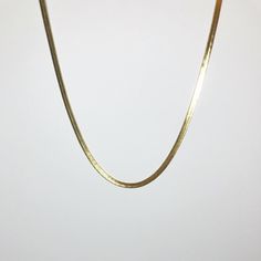 Elevate your everyday style with the Snake Herringbone Chain Necklace, a sleek and sophisticated piece designed to add effortless elegance to any outfit. Crafted from durable stainless steel and gold-plated for a luxurious finish, this 17" chain is perfect for layering or wearing alone. Its 4mm width gives it a bold yet refined appearance, making it a versatile addition to your jewelry collection. KEY BENEFITS Sleek & Timeless Design: A classic piece suitable for any occasion. Durable & Long-Las Herringbone Chain, Effortless Elegance, Gold Plated Necklace, Everyday Style, Herringbone, Everyday Fashion, Timeless Design, Jewelry Collection, Layering