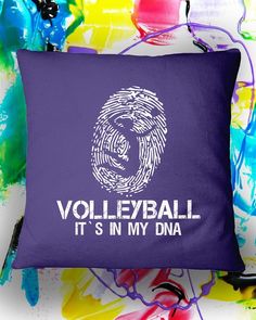 a purple pillow with the words volleyball it's in my dna printed on it