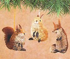 three squirrel ornaments hanging from a christmas tree