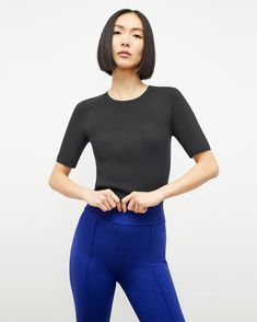 Choe Top - Eco 365Knit :: Black – M.M.LaFleur Fine Knit Stretch Crew Neck T-shirt, Seamless Second-skin Crew Neck Top, High Stretch Crew Neck Top With Ribbed Neckline, High Stretch Knit Crew Neck Top, Ribbed Stretch Crew Neck Knit Top, Ribbed Stretch Knit Top With Crew Neck, Fitted Knit Top With Ribbed Crew Neck, Stretch Crew Neck Short Sleeve Top For Work, Ribbed Crew Neck Top With Minimal Stretch