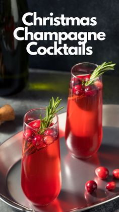 christmas champagne cocktails with cranberries and rosemary garnish on a silver tray