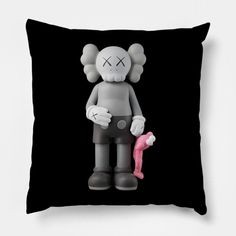 a black pillow with an image of a cartoon character holding a pink toy