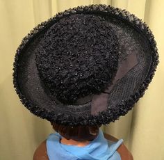 "This is a fun vintage hat, that dates from the 1950s or 60s. It is a boater style hat. Labeled \"Jacki\". It features a large, upturned brim, & grosgrain ribbon band & bow trim. Made of textured, loopy, poly raffia straw. Brim is about 3.5\" wide all around. It measures 21\" around the inside. It is in very good, vintage condition. No soil or stains. Nice & clean. Lovely!" Vintage Formal Straw Hat With Flat Brim, Victorian Wide Brim Hat For Kentucky Derby, Victorian Hat With Short Brim For Church, Formal Vintage Straw Hat With Flat Brim, Vintage Straw Hat With Short Brim For Evening, Vintage Straw Hat With Curved Brim For Royal Ascot, Vintage Brimmed Top Hat For Party, Vintage Curved Brim Top Hat For Royal Ascot, Victorian Brimmed Hat For Kentucky Derby