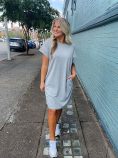 Achieve effortless style with the Always Carefree Dress! This playful t-shirt dress features short sleeves, functional pockets, AND a round neck line for a classic, comfy look. So don't worry, be happy and hop into this easy-breezy garment for some serious chill-vibes (and style)! Loose and slightly oversized fit. Perfect for game day! Model has on a small and is 5'1. Don't Worry Be Happy, Chill Vibes, Tee Shirt Dress, Easy Breezy, Don't Worry, Game Day, Be Happy, T Shirt Dress, Effortless Style