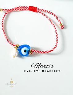 Embrace the tradition and protection of the Martis bracelet with our stunning Adjustable Evil Eye Martis Bracelet. Handcrafted with care, this bracelet features the classic red and white cord, symbolizing the arrival of March in Greek culture, adorned with a beautiful blue heart-shaped glass evil eye bead and a delicate freshwater pearl dangle. The Martis bracelet, also known as the Martaki or March bracelet, is believed to ward off evil spirits and bring good luck and prosperity to the wearer t Handmade Spiritual Heart Bracelet With Adjustable Fit, Handmade Adjustable Spiritual Heart Bracelet, Hand-strung Heart Jewelry As Gift, Hand-strung Heart Shaped Jewelry For Gift, Hand-strung Heart Shaped Jewelry Gift, Hand-strung Heart Jewelry For Gift, Hand-strung Jewelry As A Valentine's Day Gift, Hand-strung Jewelry For Valentine's Day Gift, Hand-strung Jewelry Gift For Valentine's Day